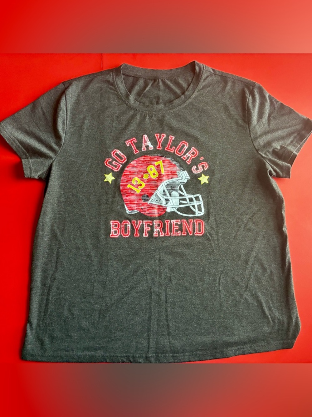 Source Unknown Gray Graphic Tee with Red Helmet and Yellow Accents